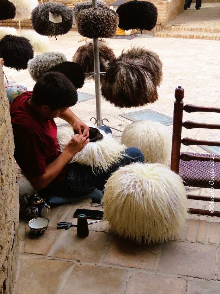 Repairing a hat. Khiva, Uzbekistan